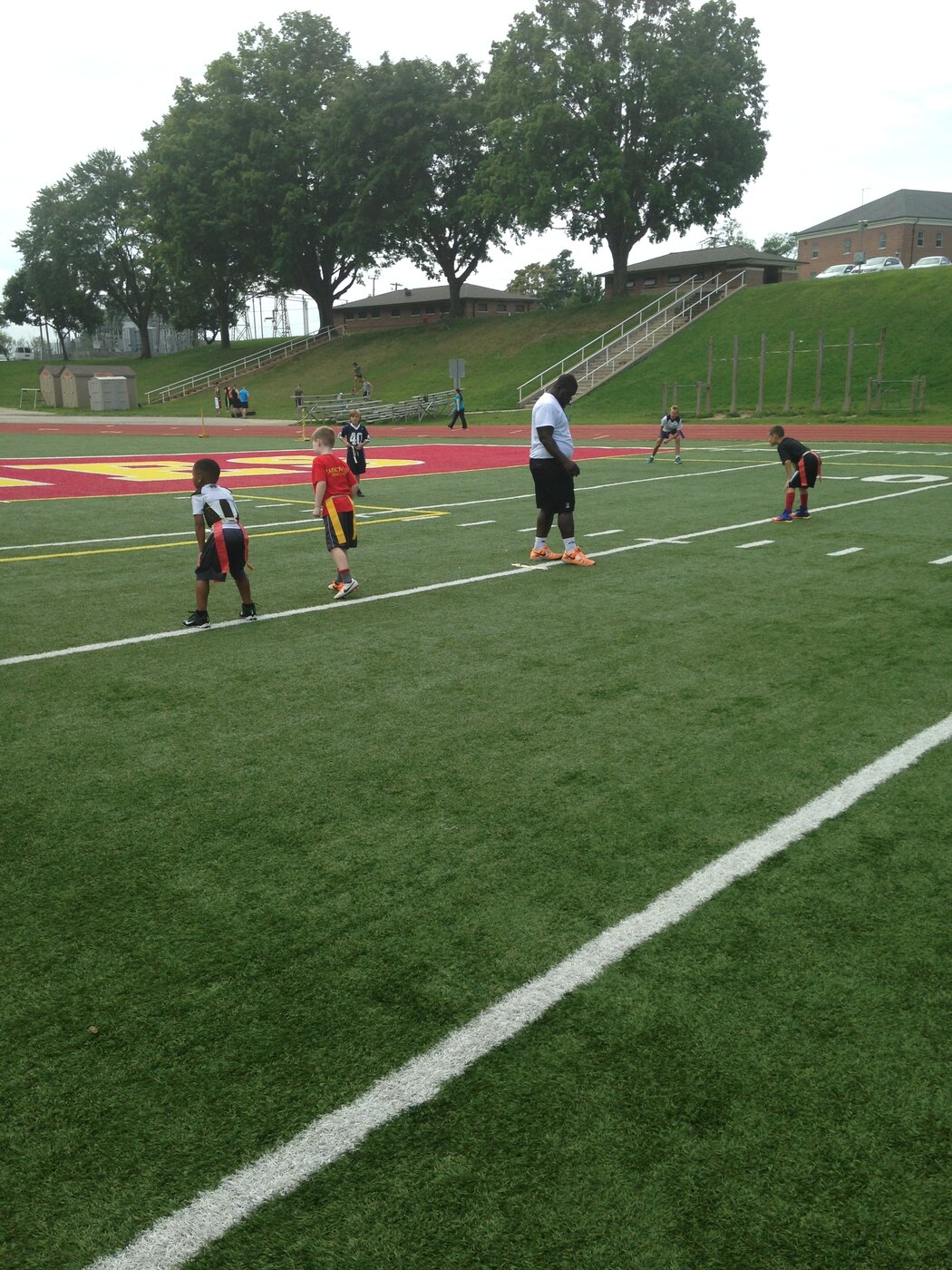 Youth athletes running drills at the Royal Athletes Quantico camp