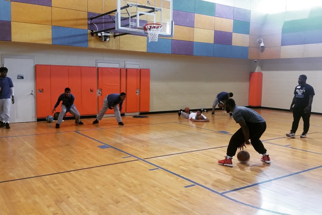 Royal Athletes coaches running a basketball session at a youth rehabilitation center